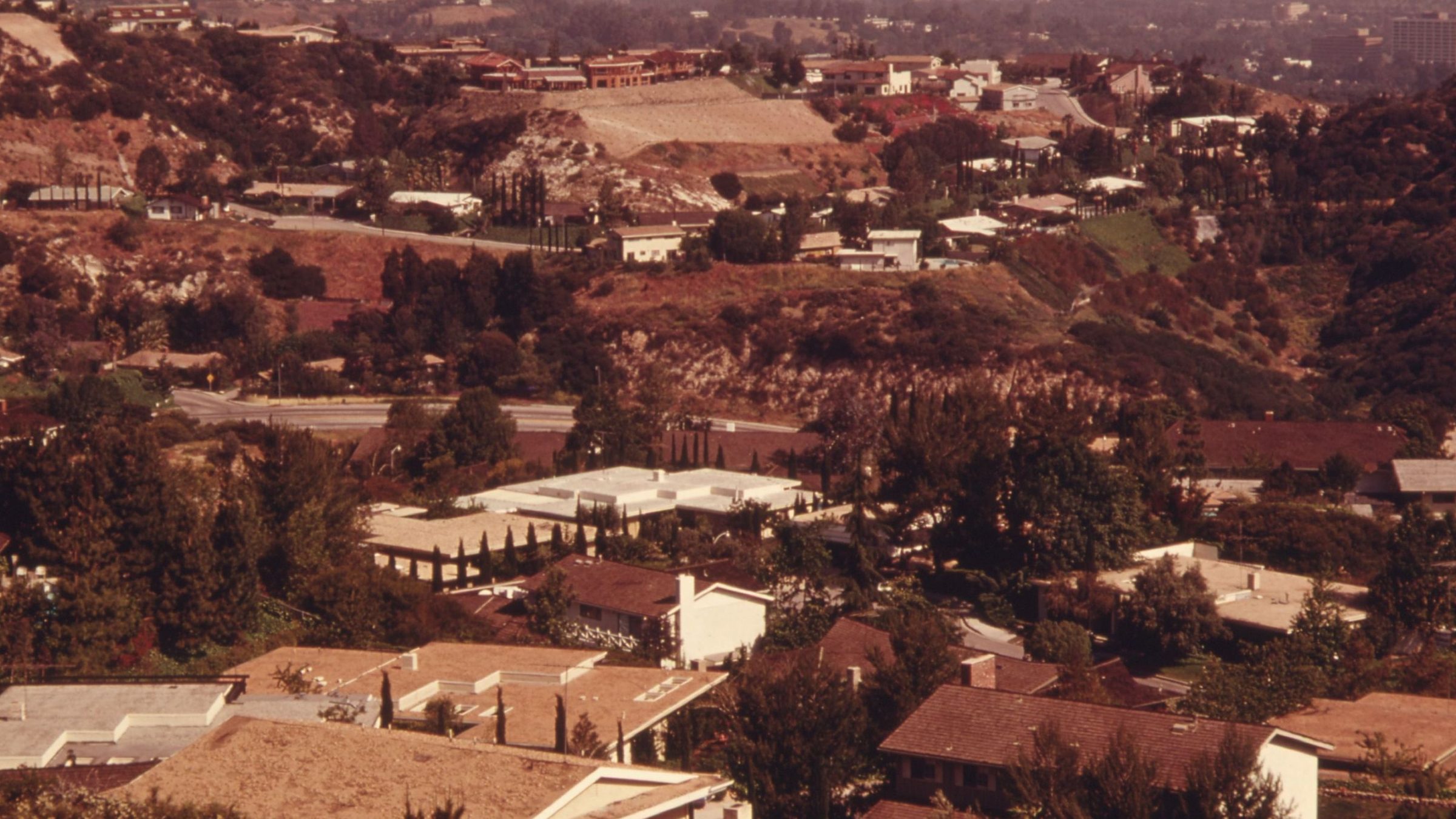 Hillside houses in Woodland Hills near Mulholland Drive, on warm colour slide film, May 1975.